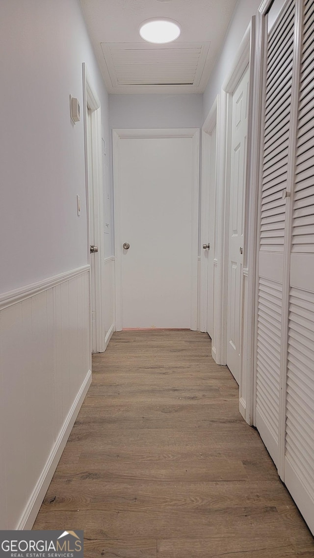 hallway with light wood-type flooring