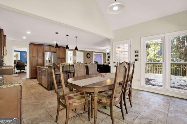 dining space featuring crown molding, recessed lighting, and high vaulted ceiling