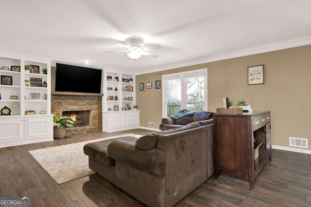 living area with visible vents, a fireplace, ornamental molding, and dark wood-style flooring