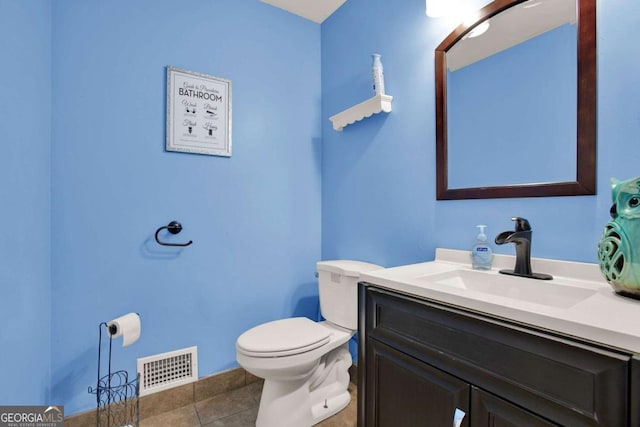 bathroom with vanity, tile patterned floors, toilet, and visible vents