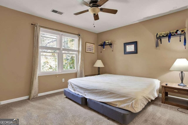 bedroom featuring visible vents, a ceiling fan, carpet, and baseboards