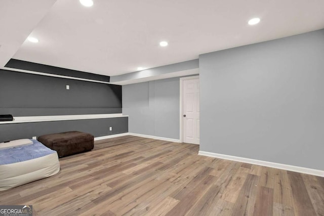 interior space with recessed lighting, baseboards, and wood finished floors