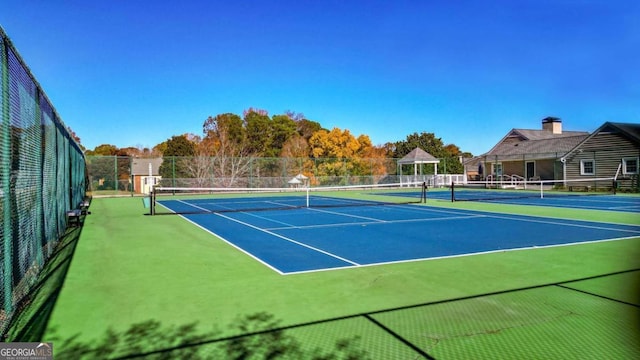 view of sport court with fence