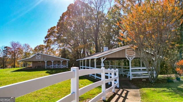 exterior space with a lawn and fence