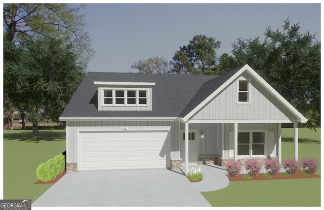 view of front of property with a porch, a garage, and a front lawn