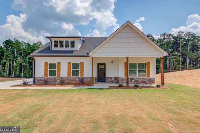 view of front of home with a front lawn and covered porch