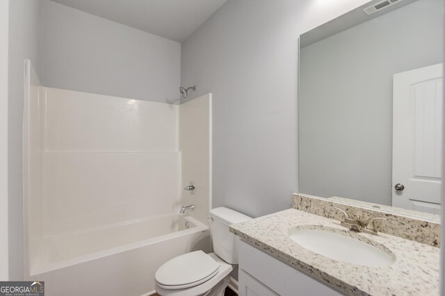 full bathroom featuring vanity, shower / bathing tub combination, and toilet