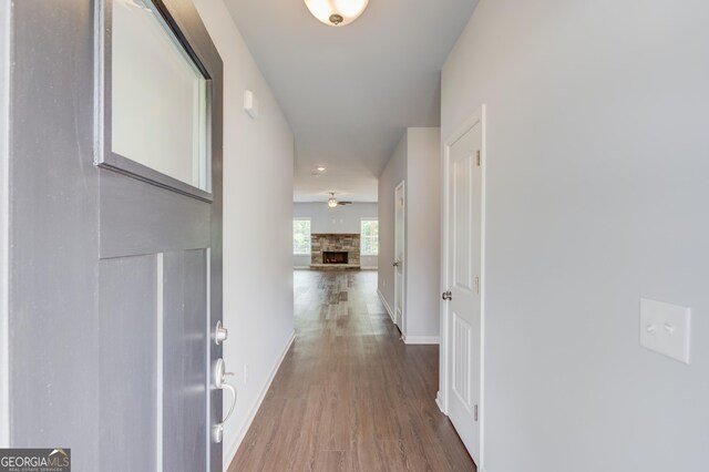 corridor with wood-type flooring