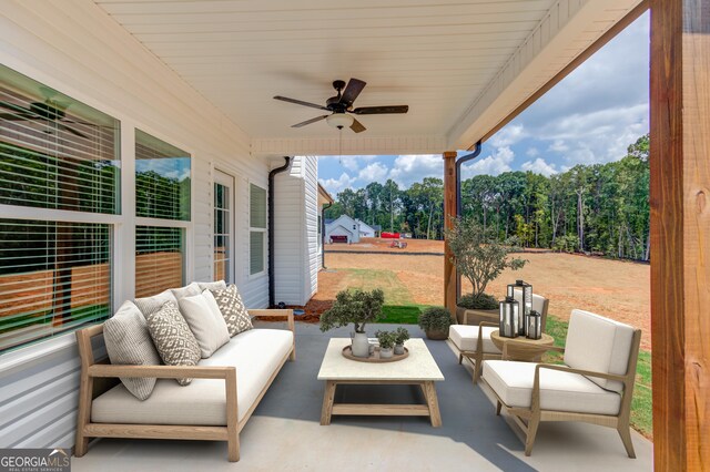 view of patio / terrace with an outdoor living space and ceiling fan