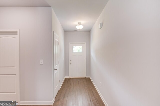 doorway to outside featuring hardwood / wood-style floors