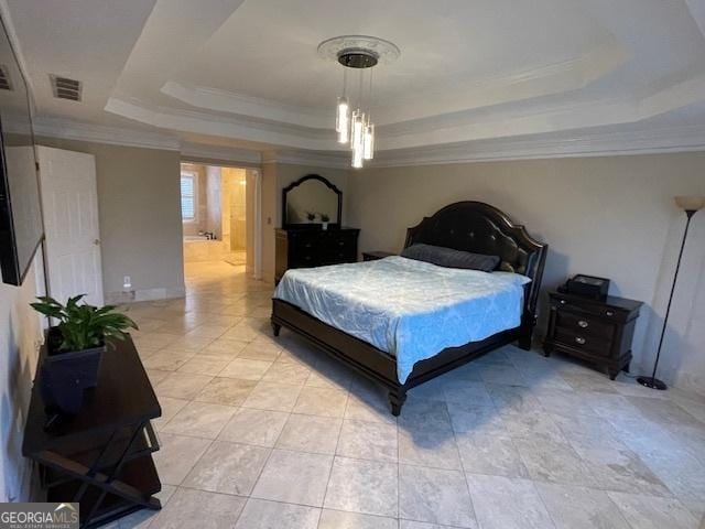 bedroom with ensuite bathroom, a raised ceiling, and crown molding