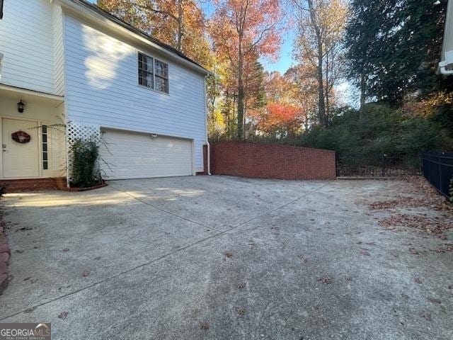 view of property exterior with a garage