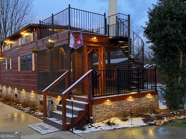 view of front of home featuring a balcony