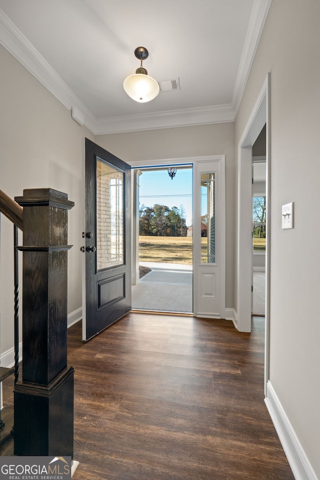 entrance foyer with crown molding and dark wood-type flooring