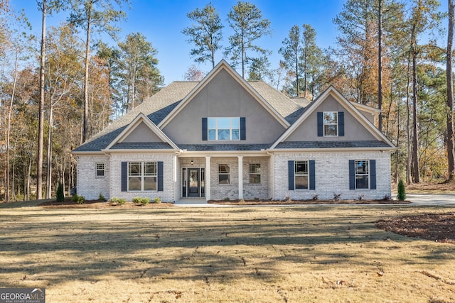 craftsman-style house with a front yard