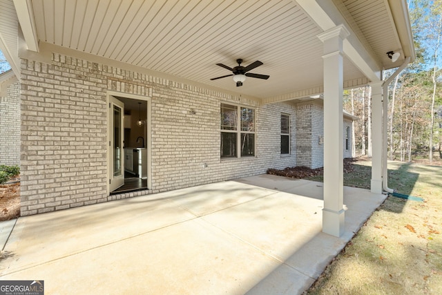 view of patio featuring ceiling fan