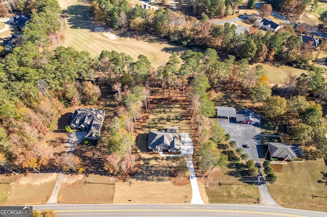 birds eye view of property with a rural view