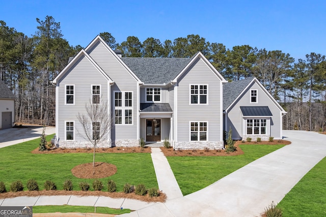 traditional home featuring a front lawn, a chimney, and a shingled roof