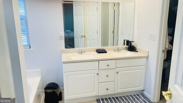 bathroom featuring a tub and vanity