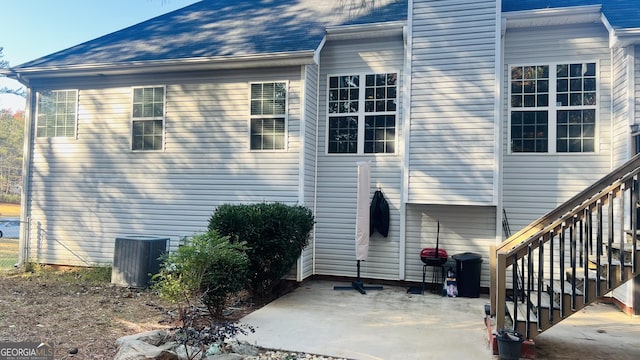 back of house with a patio and cooling unit