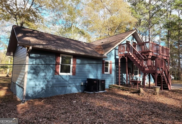 back of property featuring a wooden deck and central air condition unit