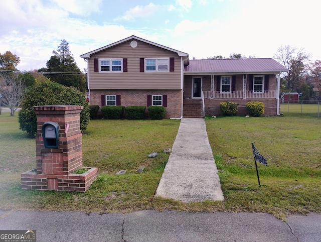 split level home with a porch and a front yard