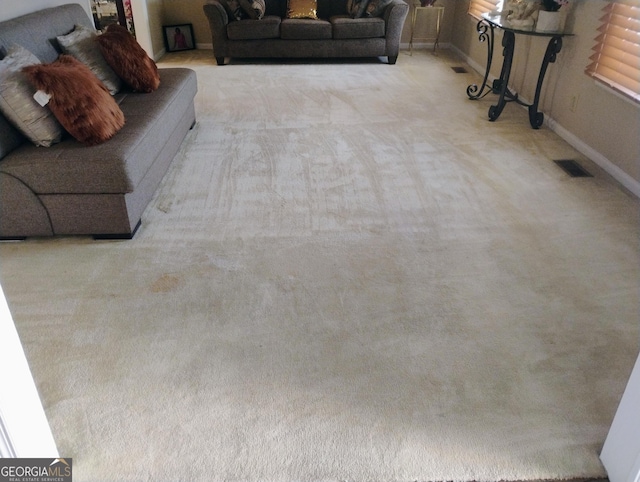 living room with light colored carpet