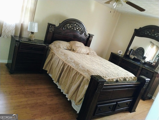 bedroom featuring ceiling fan and wood-type flooring