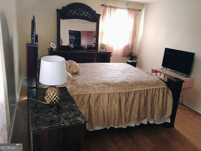 bedroom with wood-type flooring