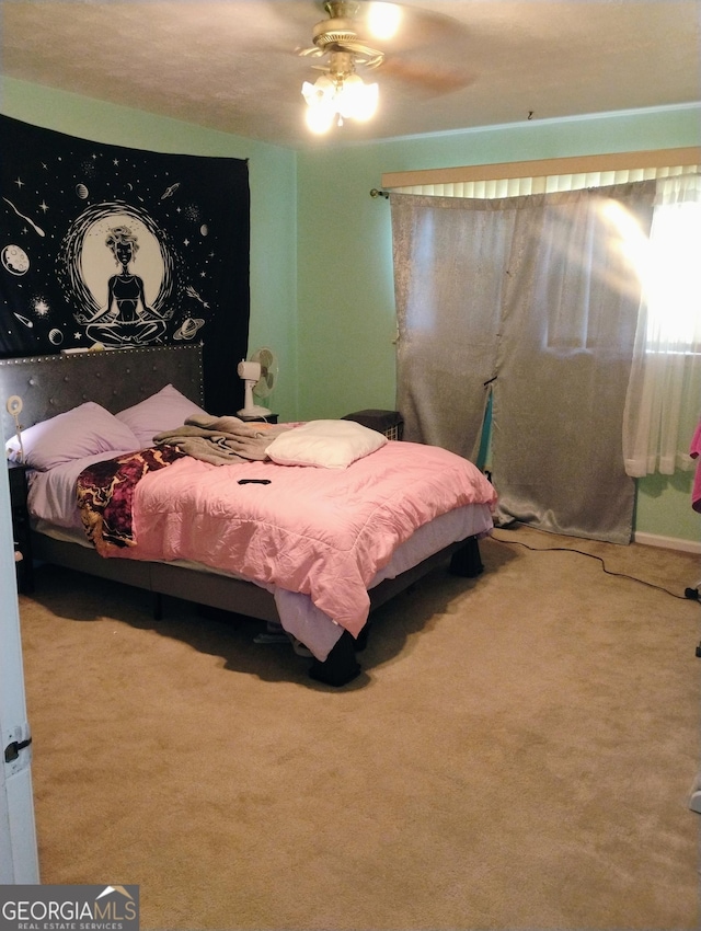 bedroom featuring carpet and ceiling fan