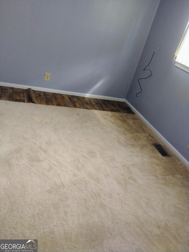 empty room with carpet flooring