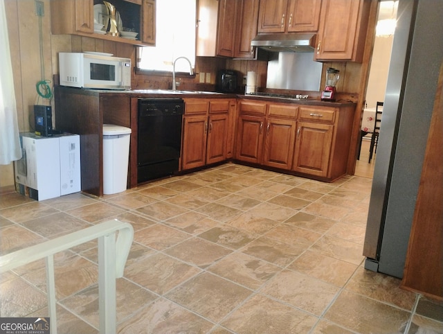 kitchen featuring dishwasher, sink, decorative backsplash, stainless steel fridge, and gas stovetop