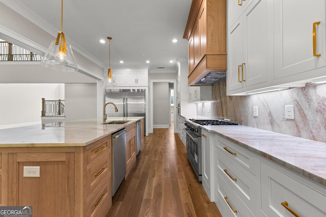 kitchen featuring crown molding, decorative backsplash, dark wood-style flooring, light stone counters, and appliances with stainless steel finishes