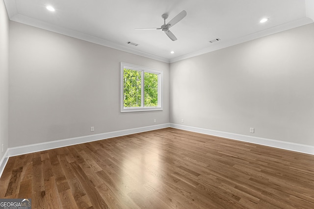 unfurnished room featuring crown molding, ceiling fan, baseboards, and wood finished floors