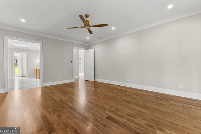 interior space featuring ceiling fan, recessed lighting, baseboards, wood finished floors, and ornamental molding