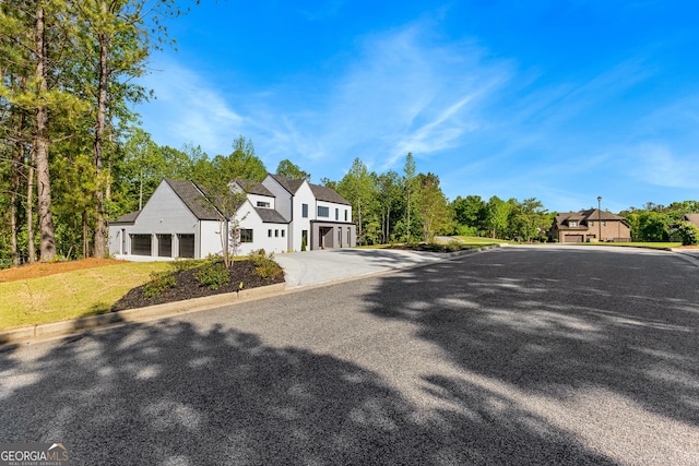 view of street with a residential view and curbs