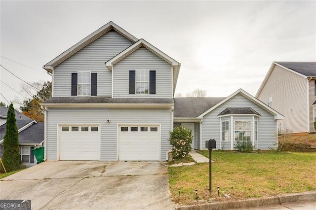 view of front property featuring a front yard and a garage