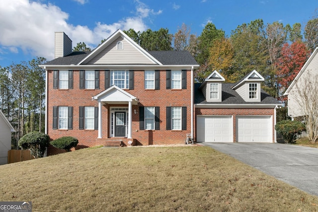 colonial inspired home with a front lawn