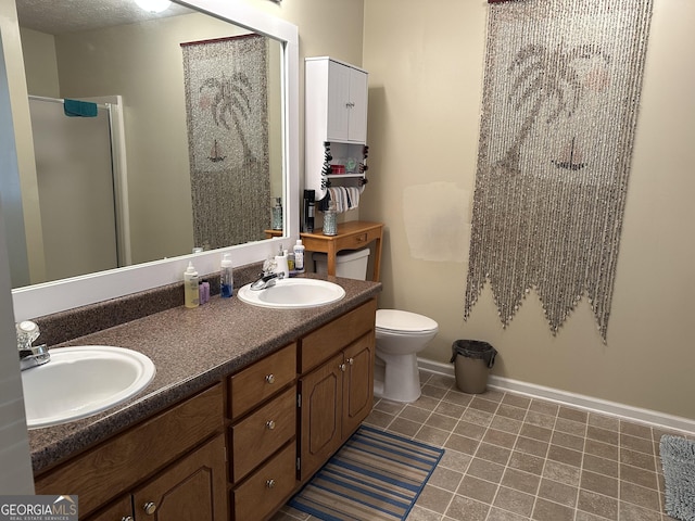 bathroom featuring vanity, tile patterned flooring, toilet, a textured ceiling, and an enclosed shower