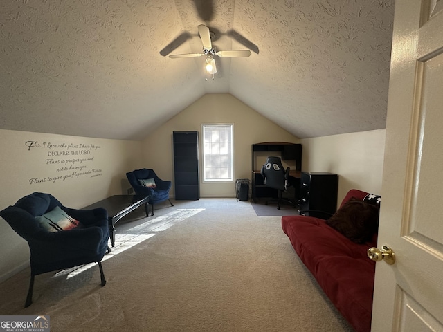 sitting room with carpet, ceiling fan, lofted ceiling, and a textured ceiling