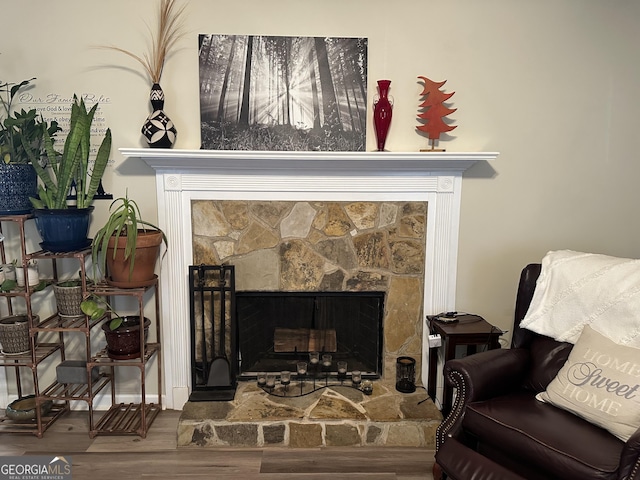 details with a fireplace and hardwood / wood-style flooring