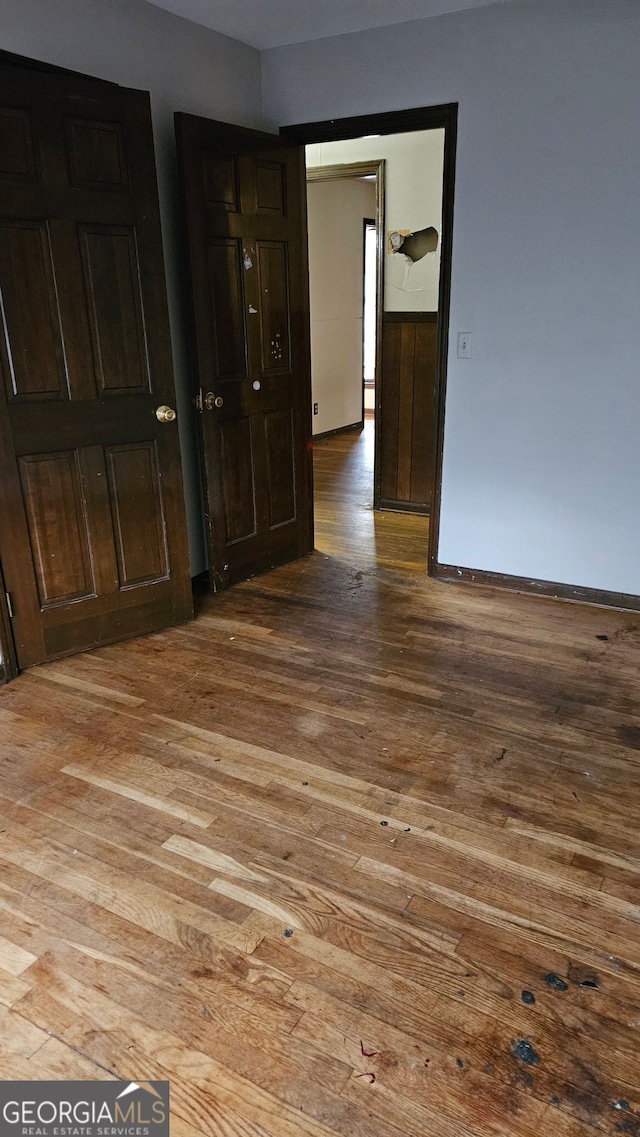 spare room with hardwood / wood-style flooring