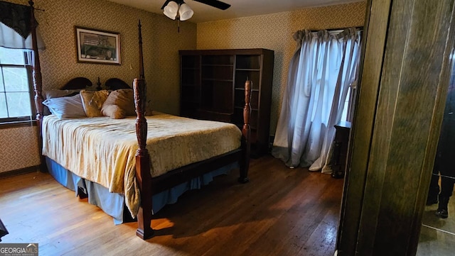 bedroom featuring wood-type flooring and ceiling fan