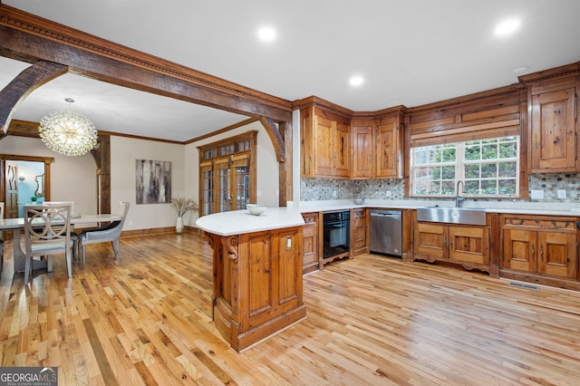 kitchen featuring kitchen peninsula, dishwasher, light hardwood / wood-style floors, and sink