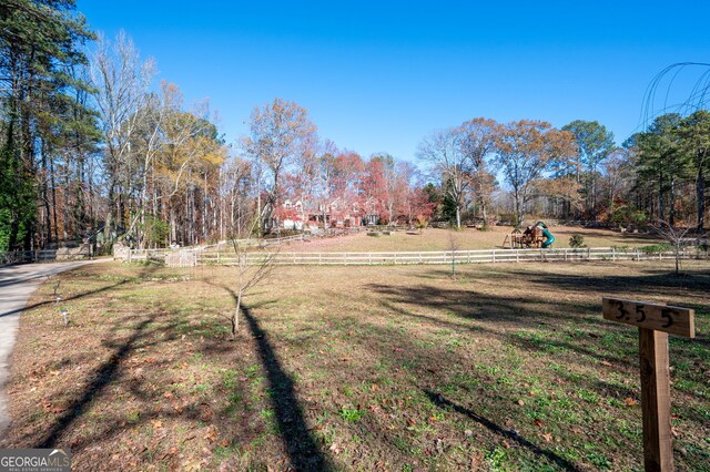 view of yard with a rural view