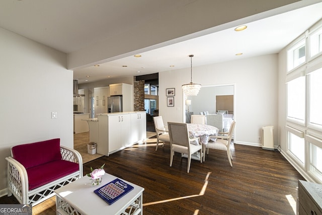 living room featuring dark hardwood / wood-style flooring and a notable chandelier