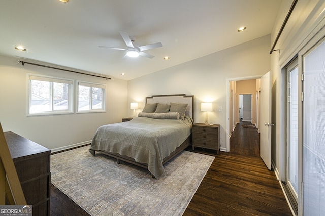 bedroom featuring lofted ceiling, ceiling fan, and dark wood-type flooring