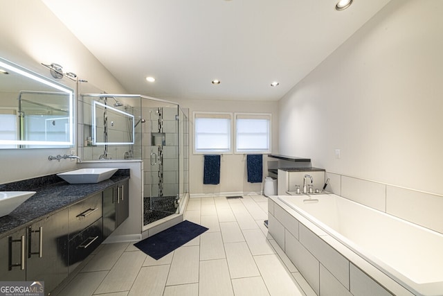 bathroom featuring vanity and plus walk in shower