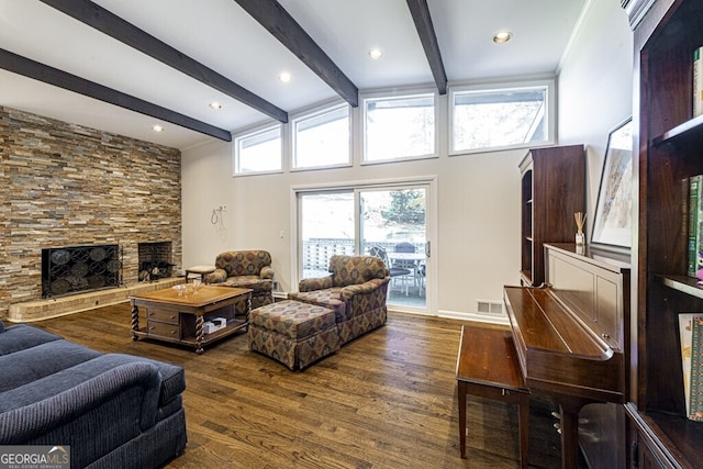 living room featuring a fireplace, vaulted ceiling with beams, and dark wood-type flooring