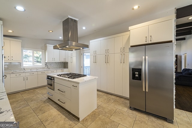 kitchen featuring a center island, stainless steel appliances, backsplash, island range hood, and white cabinets